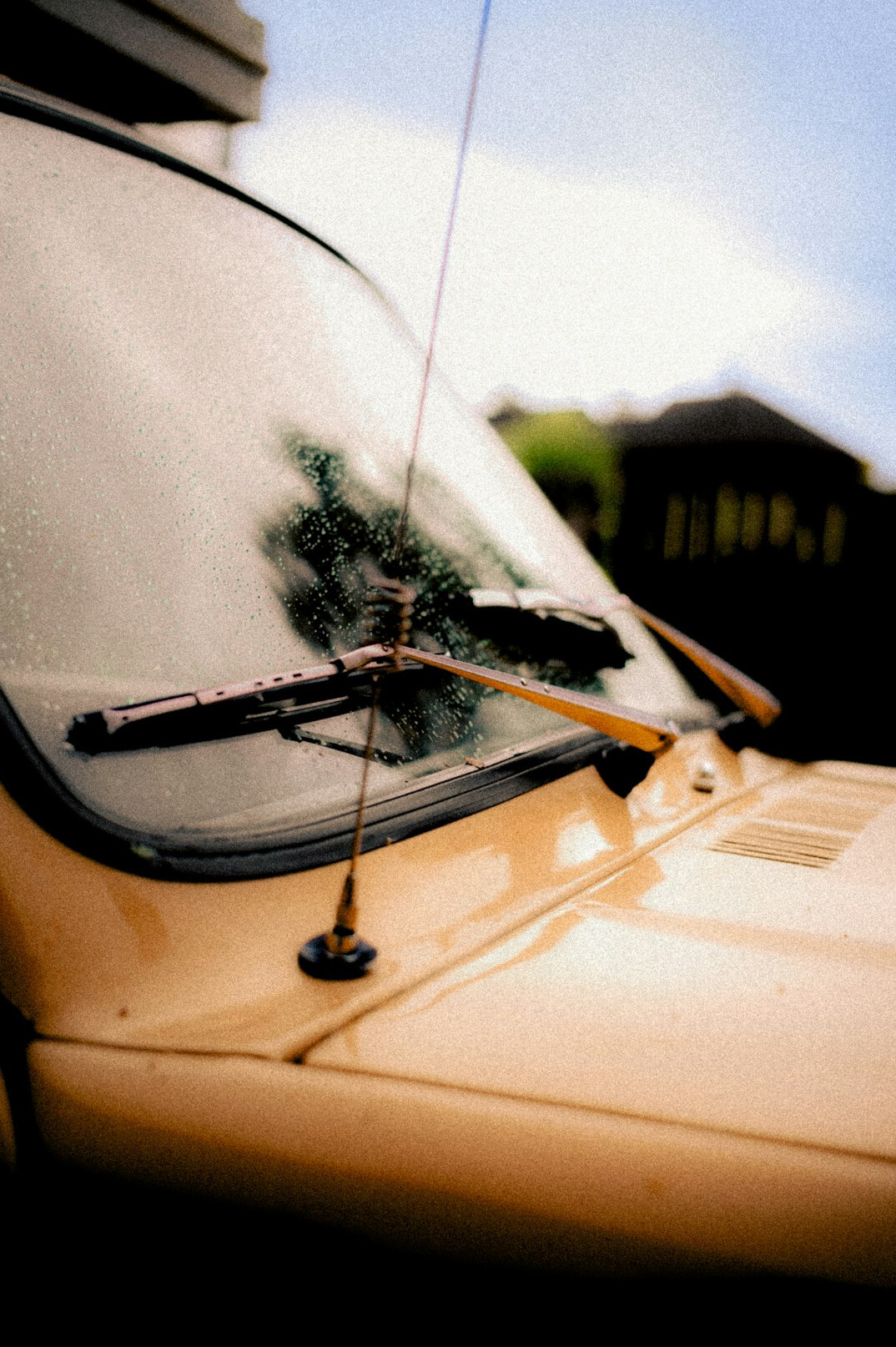 Car with bonnet open in daylight