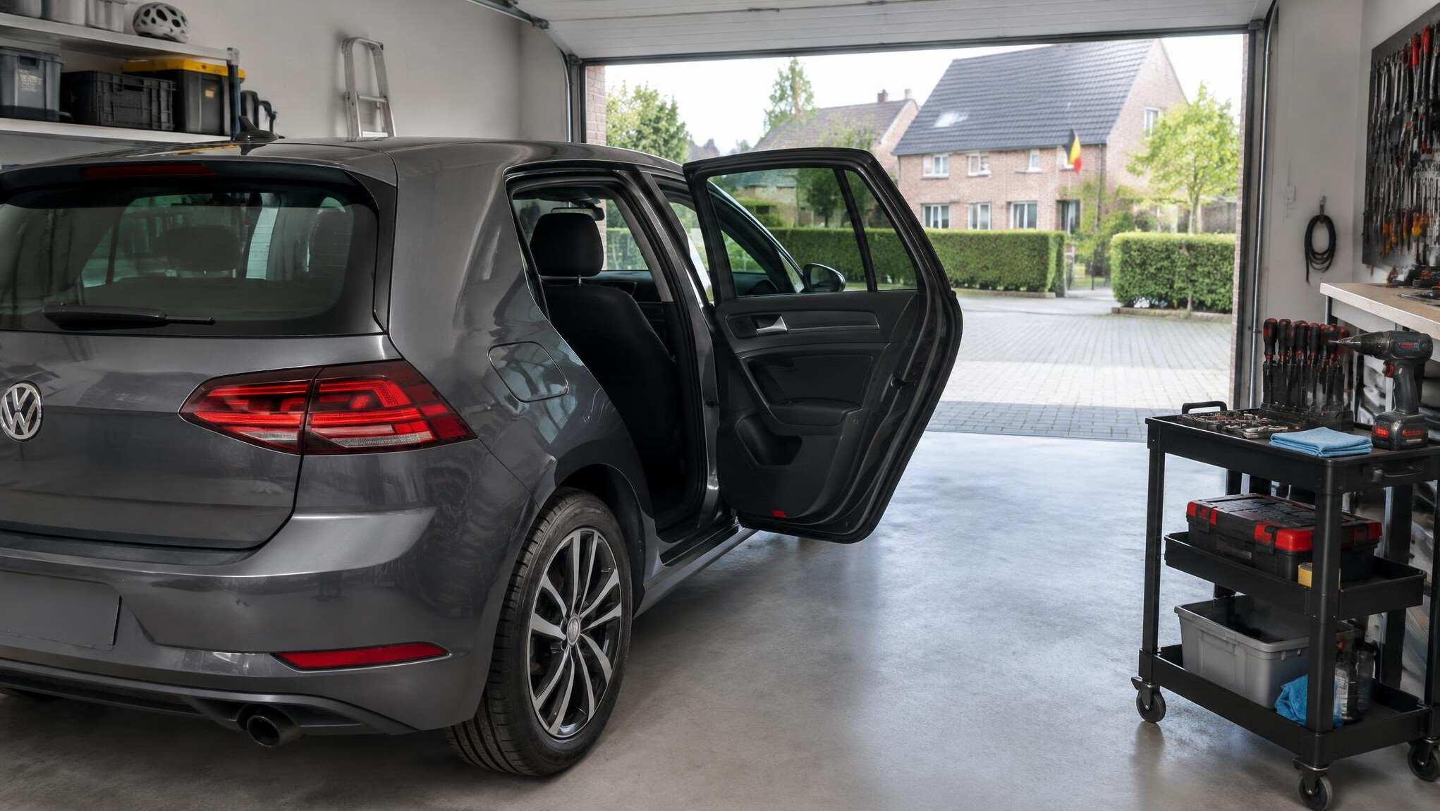 Car in a home garage with open hood